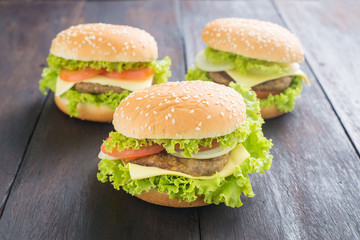 Delicious homemade hamburger on wooden desk.