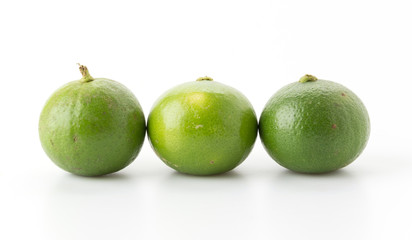 green lemon isolated on white background