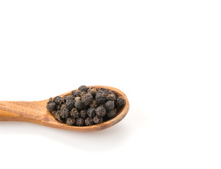 Black pepper with wood spoon