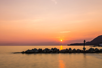 Naklejka na ściany i meble sunset behind the castle of Trieste