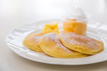 Pan cake with ice cream on table