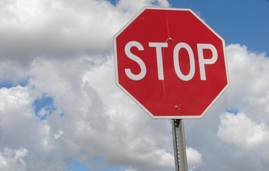 stop sign with clouds