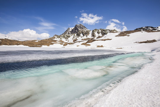 Spring is coming and lake Emet in the Spluga Valley is slowly thawing, Lombardy