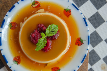 caramel custard dessert and red berry with honey