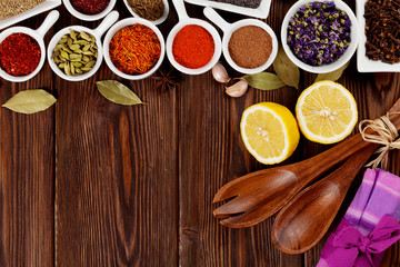 Various spices on wooden background