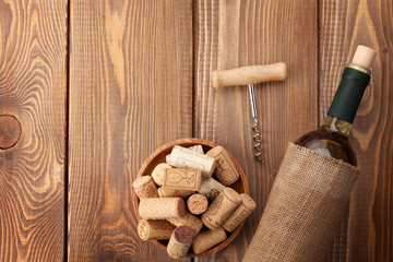 White wine bottle, corks and corkscrew