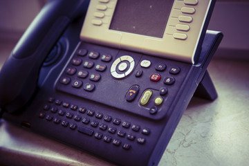 black and white digital phone on the office table