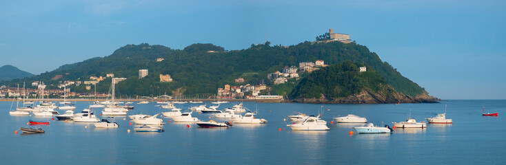 Fototapeta na wymiar Boats, water and beach in city of Donostia (San Sebastian), Basque Country.