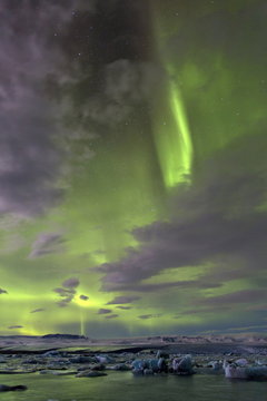 The Aurora Borealis (Northern Lights) captured in the night sky over Jokulsarlon glacial lagoon on the edge of the Vatnajokull National Park, during winter, South Iceland, Iceland
