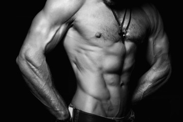 Fototapeta na wymiar Muscular and sexy torso of young man.