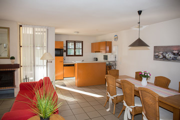 Orange modern kitchen in a modern house