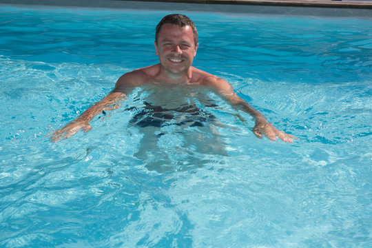 Nice man swimming in pool, portrait