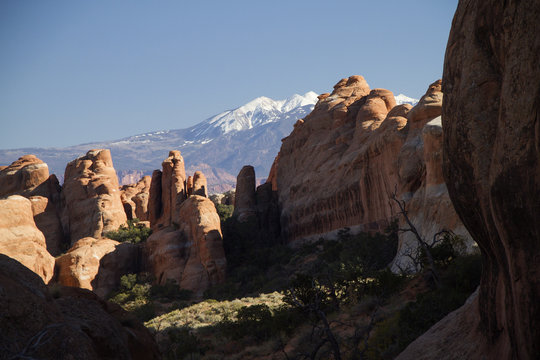 Rock formations with the snow covered La Sal Mountains in the background.Arches National Park, Utah