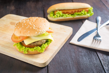 fast food hamburger, hot dog on the wooden background