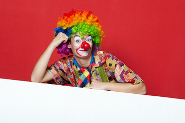 funny clown with tie on blank board