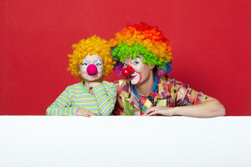 Obraz na płótnie Canvas big and little funny clowns photo
