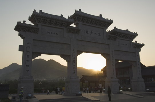 Sunset at the entrance gate to Shaolin temple, birthplace of Kung Fu martial art, Shaolin, Henan Province, China