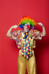 funny clown with glasses on red