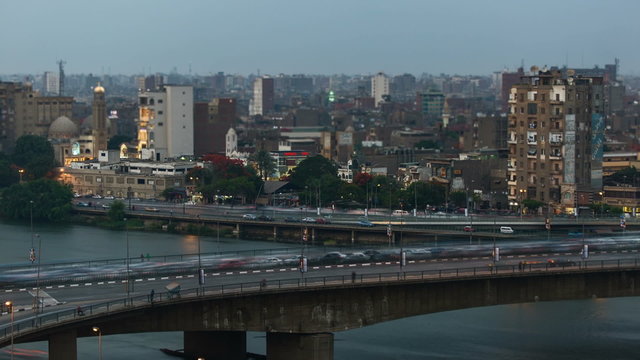 Time lapse of traffic in Cairo center, day to night transition. The 15th May Bridge / 26th July Corridor in the foreground, the Corniche in the background