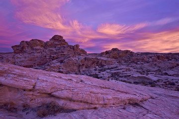 Vibrant orange clouds over red and white sandstone at sunset, Gold Butte, Nevada