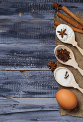 Ingredients for baking - egg, flour, sugar, anise, cinnamon