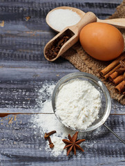 Ingredients for baking - egg, flour, sugar, anise, cinnamon