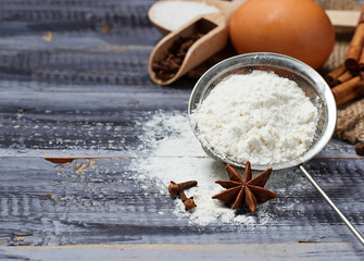 Obraz na płótnie Canvas Ingredients for baking - egg, flour, sugar, anise, cinnamon