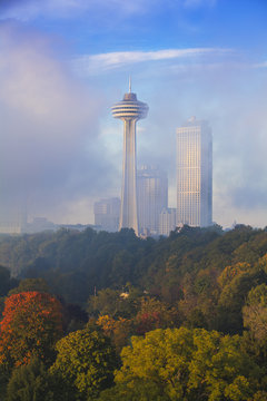 Mist from Horseshoe Falls swirling in front of Skylon Tower at dawn, Niagara Falls, Niagara, Ontario, Canada