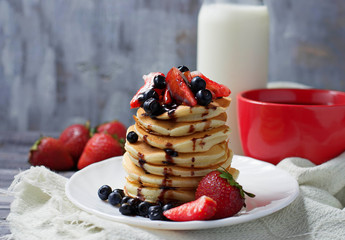 Breakfast with pancakes, coffee and milk