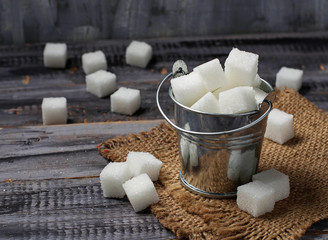 White refined sugar in iron bucket