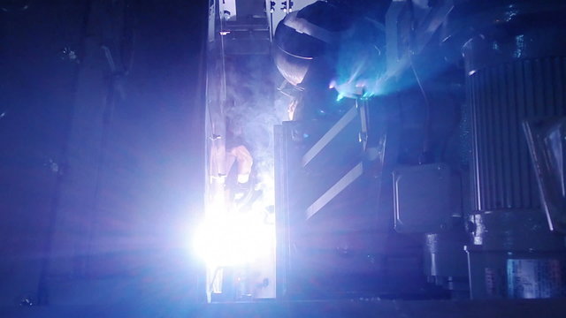 Industrial workers welding on an industrial plant.