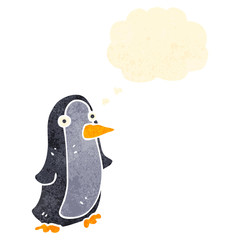 retro cartoon christmas penguin with thought bubble