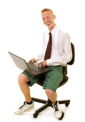 Young funny business man using laptop