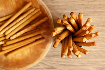 Breadsticks grissini on wooden background