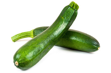 Fresh courgettes on white background