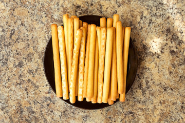 Breadsticks grissini on a plate