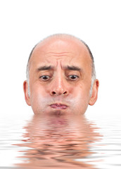 Man holding his breath as he is about to drown in water