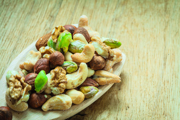 Varieties of nuts: cashew, pistachio, almond.
