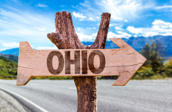 Ohio wooden sign with highway on background