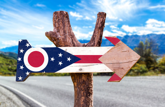 Ohio Flag wooden sign with highway on background