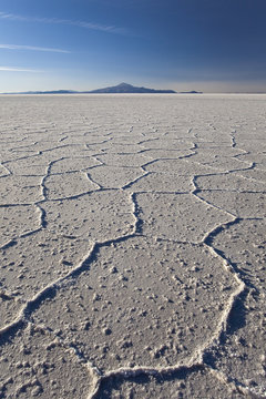 Volcano Tunupa on the horizon of the Salar de Uyuni, the biggest salt desert in the world, Oruro, Bolivia
