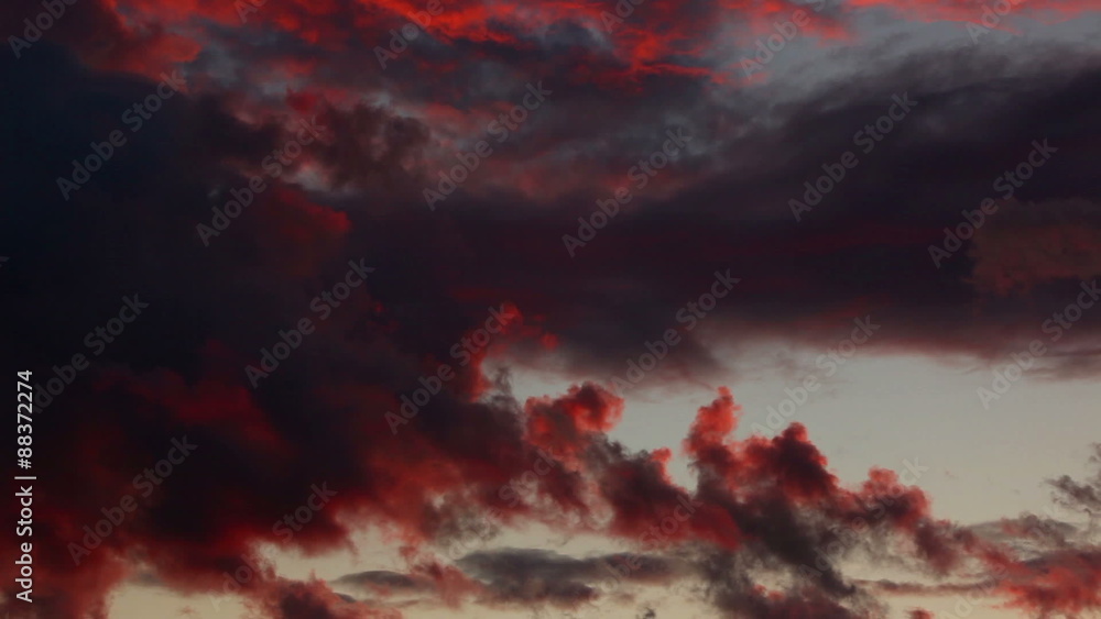 Sticker Dramatic black and red sunset clouds.
