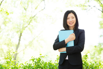 asian businesswoman in the park 