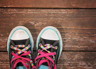 a wide angle photo of a pair of generic looking shoes like conve