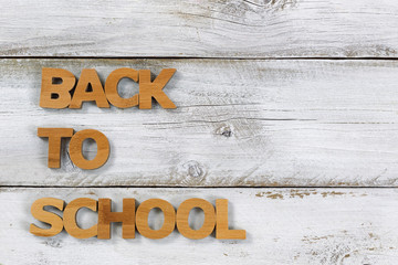 Back to school letters on old white wooden boards