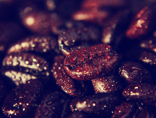 a background with coffee beans in macro (extremely shallow depth