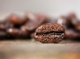 a background with coffee beans in macro (extremely shallow depth