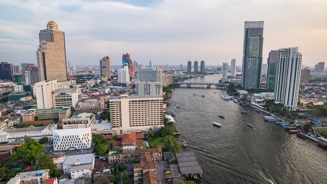 Aerial view of Bangkok skyline and Chao Phraya river when sunset