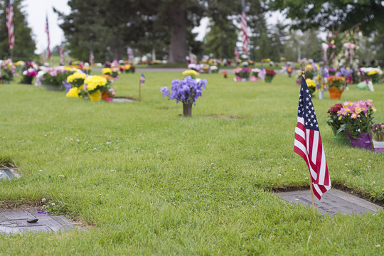 American Flag On Veteran Graveside On Memorial Day