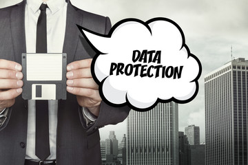 Data protection text on speech bubble with businessman holding